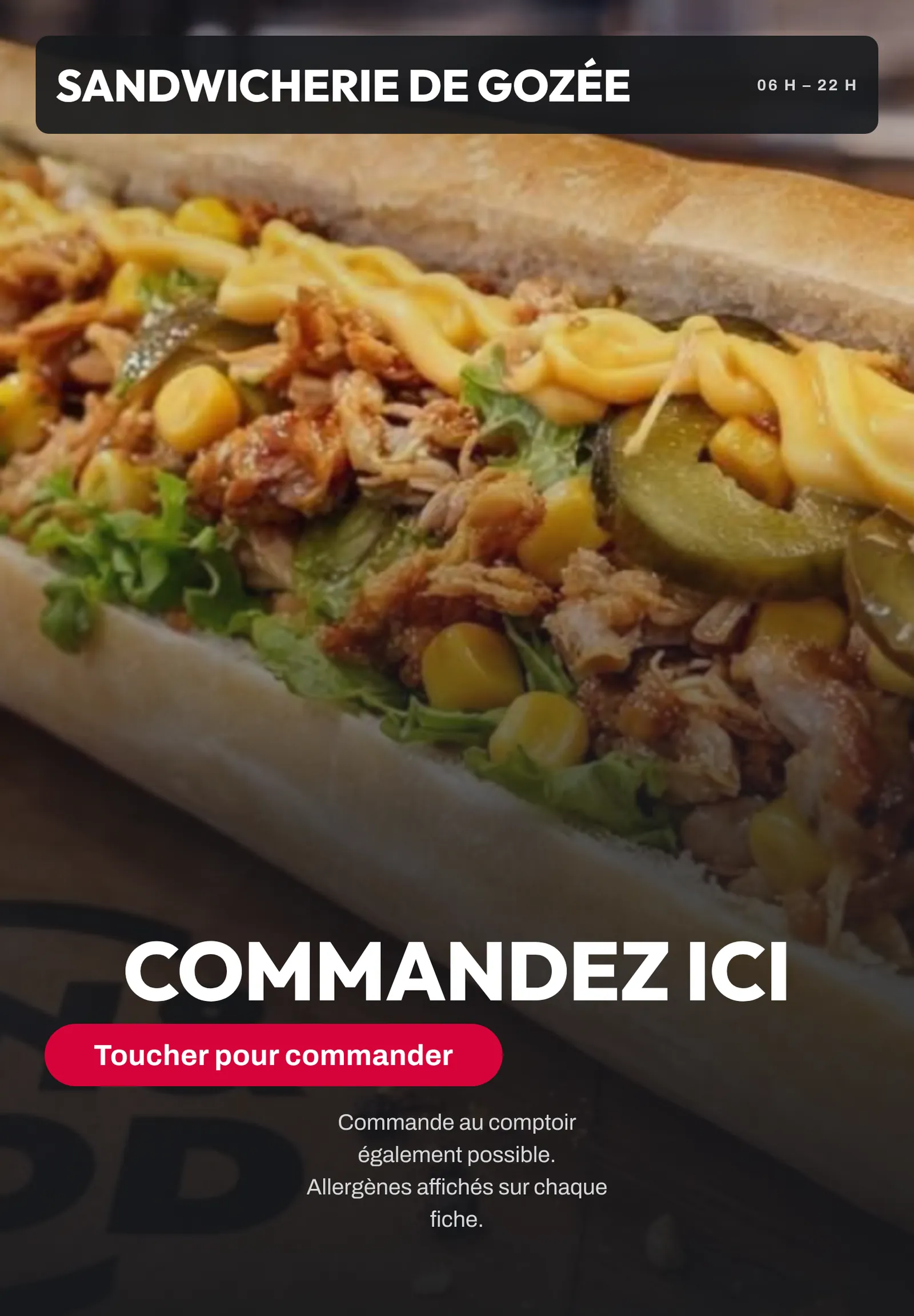 La borne de commande en salle, à l'enseigne du commerce : « Commandez ici ».